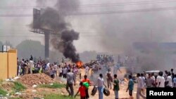 People take part in protests over fuel subsidy cuts in Khartoum, September 25, 2013. 