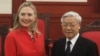 U.S. Secretary of State Hillary Clinton (L) poses for a photo with Vietnam's Communist Party's General Secretary Nguyen Phu Trong at the Party's Head Office in Hanoi, July 10, 2012.