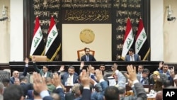 دیمەنی کۆبوونەوەیەکی پەرلەمانی عێراق بە سەرۆکایەتی محەمەد حەلبووسی لە مانگی حەوتی ساڵی 2023.