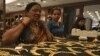 A customer tries on a gold necklace inside a jewellery showroom in the southern Indian city of Hyderabad, April 11, 2012.