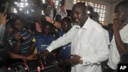 FILE - Former soccer star George Weah, Presidential candidate for the Coalition for Democratic Change cast his vote during a Presidential election in Monrovia, Liberia. Tuesday Oct. 10, 2017.