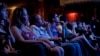Audience members watch "Big Easy," a film at the Paramount Theater during the South by Southwest festival, Austin, Texas, March, 17, 2012.