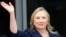 US Secretary of States Hillary Clinton waves as she arrives to attend the Asia-Pacific Economic Cooperation (APEC) summit on September 8, 2012. 