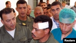 A Tunisian soldier wounded in the face during an ongoing hunt for a group of jihadists arrives at the hospital in Kasserine, the regional capital of the western region of Mount Chaambi, on May 6, 2013.