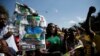 File - Supporters of the ruling ZANU-PF party of President Emmerson Mnangagwa celebrate following general elections in Harare, Zimbabwe, July 31, 2018. 