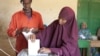 FILE - Woman casts her ballot in Somaliland municipal elections, Nov. 28, 2012. (Credit: Kate Stanworth)
