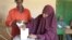 FILE - Woman casts her ballot in Somaliland municipal elections, Nov. 28, 2012. (Credit: Kate Stanworth)