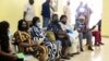 FILE - People wait after receiving the AstraZeneca's COVID-19 vaccine at the National Hospital in Abuja, Nigeria, March 31, 2021.