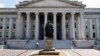 FILE - A statue of former Treasury Secretary Albert Gallatin stands outside the Treasury Building in Washington.