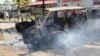 A burning vehicle which was set on fire by protesting Muslim youths after Islamic cleric Aboud Rogo Mohammed was killed in Mombasa, Kenya, Aug. 27, 2012. 