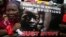 A woman holds a sign during a protest demanding the release of abducted secondary school girls from the remote village of Chibok, in Lagos, May 5, 2014. 
