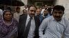 Tahir Naveed Chaudhry, center, lawyer of Christian girl accused of blasphemy, leaves after court hearing in Islamabad, Pakistan, Sept. 3, 2012. 