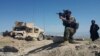 A member of Afghanistan's special forces points his gun as he observes the enemy lines in Achin district of Nangarhar province, in eastern Afghanistan April 14, 2017.