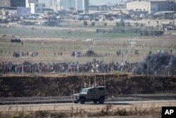 Palestinian demonstrators protest at the Israel Gaza border, Aug. 17, 2018.