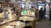 Customers check out the selection of books at Politics and Prose, an independent bookstore in Washington, D.C. (J. Taboh/VOA) 
