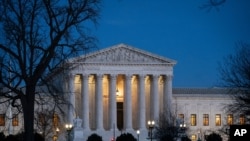 Night falls on the Supreme Court in Washington, Jan. 22, 2020.