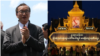 (ឆ្វេង) លោក សម រង្ស៊ី ប្រធានស្តីទីគណបក្សសង្គ្រោះជាតិដែលត្រូវបានតុលាការរំលាយ និងស្តូបតែងលម្អនៃព្រះមហាក្សត្រកម្ពុជាព្របាទ នរោត្តម សីហមុនី នៅមុខព្រះបរមរាជវាំងក្នុងរាជធានីភ្នំពេញ។ 