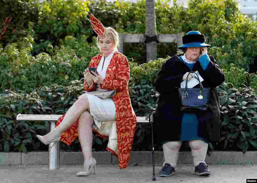 Racegoers are seen during the Cheltenham Festival at Cheltenham Racecourse in Cheltenham, Britain.
