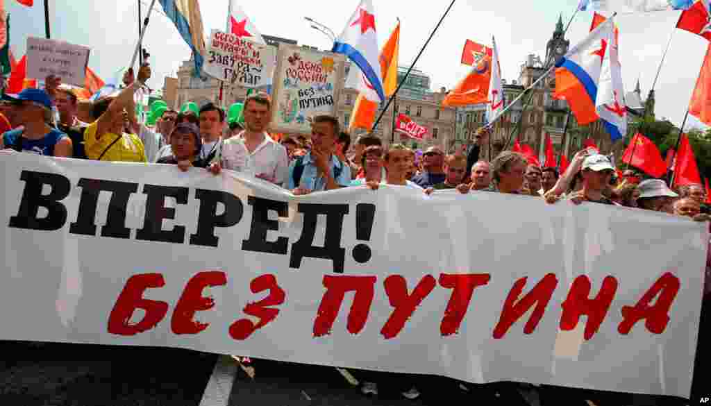 Protesters carry a banner reading, "Russia Go Forward without Putin" in Moscow.