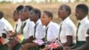 School children sing as they wait for a visit by Britain's Prince Harry, at Nalikule College of Education in Malawi, Sept. 29, 2019.