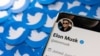 FILE PHOTO: Illustration shows Elon Musk's Twitter profile on smartphone and printed Twitter logos