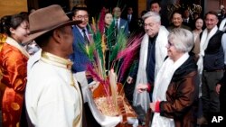 U.S. Ambassador to China Terry Branstad and his wife, Christine, are greeted in Lhasa in western China's Tibet Autonomous Region, May 21, 2019. Branstad made a rare visit to Tibet to meet local officials and raise concerns about restrictions on Buddhist practices and the preservation of the Himalayan region's unique culture and language.