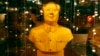 FILE - A golden bust of the late Chairman Mao Zedong, on display for sale at a Beijing department store.