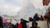 Supporters of U.S. President Donald Trump clash with police officers in front of the U.S. Capitol Building in Washington, January 6, 2021.