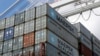 FILE - containers wait to be unloaded from a ship at the Port of Baltimore in Baltimore. 