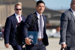 Acting-Secretary of Homeland Security Chad Wolf, center, arrives to join President Donald Trump at Andrews Air Force Base in Md., Aug. 18, 2020.