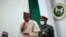 FILE - Nigeria's President Muhammadu Buhari speaks during a meeting in Katsina, Nigeria, Dec. 18, 2020. 
