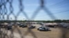 FILE - United States Border Patrol vehicles and temporary structures are pictured under the Del Rio Port of Entry during its reopening after being closed for over a week due to an influx of migrants, Sept. 25, 2021.