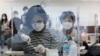 Medical workers attend a training to learn how to give coronavirus vaccine shots at the Korean Nurses Association in Seoul, South Korea, Feb. 17, 2021.