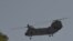 A US military helicopter is pictured flying near the US Embassy in Kabul, Aug. 15, 2021.