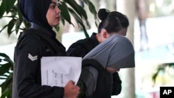 被告印尼人茜蒂艾莎2018年6月27日被带到马来西亚高等法院（美联社）