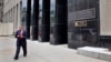 FILE - A man walks out of the Export-Import Bank of the U.S. in Washington.