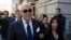 FILE - Roger Stone, with his wife, Nydia Stone, leaves federal court in Washington, Nov. 15, 2019. Prosecutors asked that he be given seven to nine years in prison for witness tampering and obstruction, but the Justice Department intervened. 