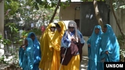 The Somali government identified the woman in the center of this 2018 UNSOM photo as the suicide bomber who killed eight people, including Mogadishu Mayor Abdirahman Omar Osman, in a July 24, 2019, attack.