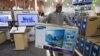 Jovel Cetoute, after waiting in line for several hours at the Pembroke Pines, Fla. Best Buy, Nov. 22, 2012 got the tv he wanted. 
