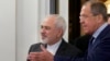 Russian Foreign Minister Sergey Lavrov, right, welcomes his Iranian counterpart, Mohammad Javad Zarif, at their meeting in Moscow, Russia, Aug. 17, 2015. 