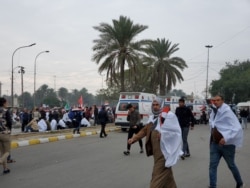 Ambulances line up outside the protest during morning hours on Jan. 24, 2020 in Baghdad. (H.Murdock/VOA)