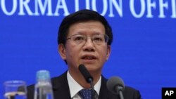 FILE - Wu Yanhua, deputy director of the national space agency, speaks during a press conference held in Beijing, China, Jan. 14, 2019.