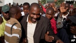 Foto Achiv: Depite Ayisyen Arnel Belizaire nan Potoprens, Ayiti, 28 Oct. 2011. 