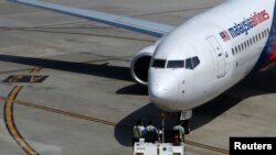 هواپیمای خطوط هوایی مالزی روی باند فوردگاه کوآلا لامپور - ۲۸ تیرماه