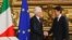 Italian President Sergio Mattarella (L) shakes hands with Premier Giuseppe Conte during the swearing-in ceremony for Italy's new government at Rome's Quirinale Presidential Palace, June 1, 2018. 