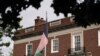 FILE - An Afghan flag flutters outside the Afghan embassy in Washington, Aug. 15, 2021. 