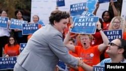 FILE - Democratic congressional candidate Katie Porter, running in 45th Congressional District, campaigns on the University of Irvine campus in Irvine, California.