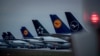 FILE - Aircrafts of German Lufthansa airline are parked on a runway at the airport in Frankfurt, Germany, May 4, 2020.