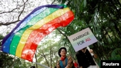 FILE - Thai LGBT community participates in Gay Freedom Day Parade in Bangkok, Thailand, Nov. 29, 2018. 