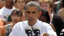 President Barack Obama gestures during a rally at Norfolk State University in Norfolk, Virginia, Tuesday, Sept. 4, 2012.
